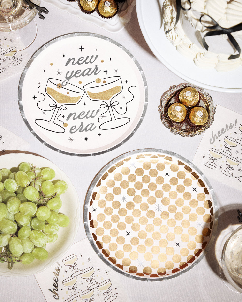 Decorative plates with New Year's designs on a festive table setting.
