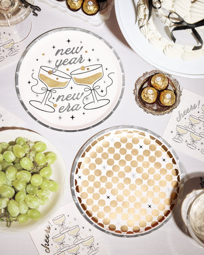 Decorative plates with New Year's designs on a festive table setting.