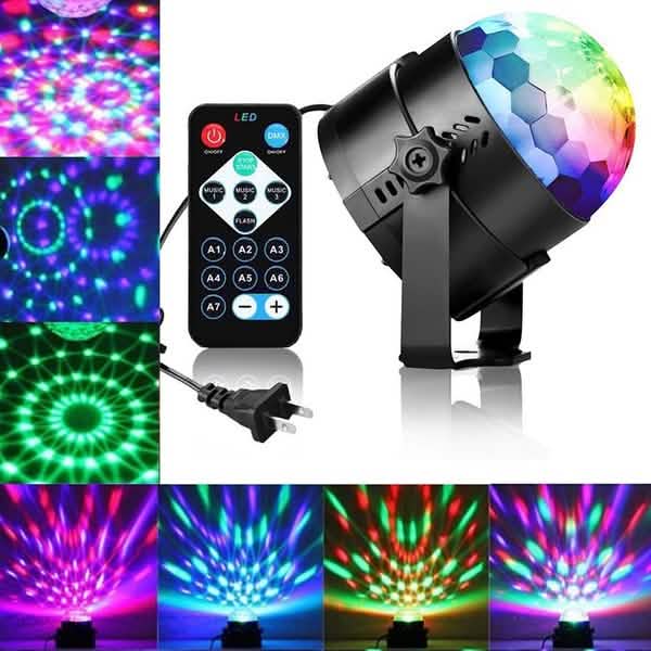 LED disco ball with remote control and power cord, showing colorful light effects.