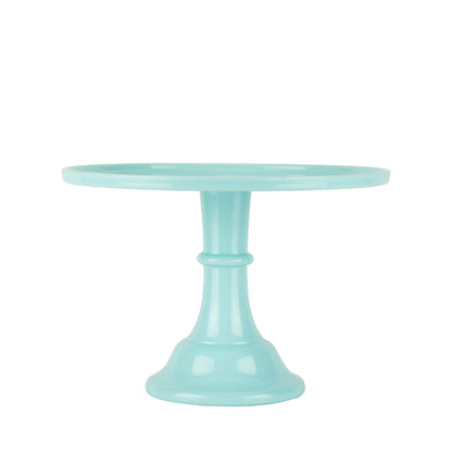 Mint green cake stand on a white background