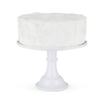 White melamine cake stand with a white cake on it.