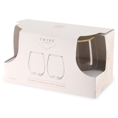 Two gilded stemless wine glasses in a Twine packaging box on a white background