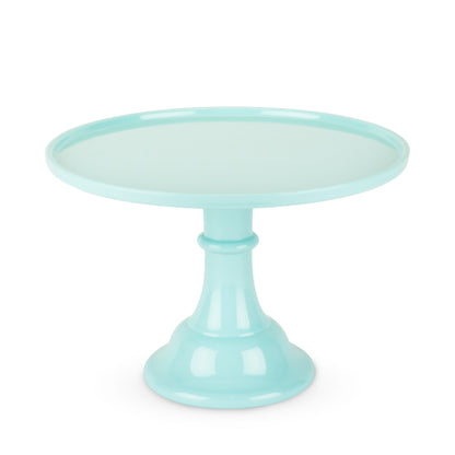 Mint green cake stand on a white background