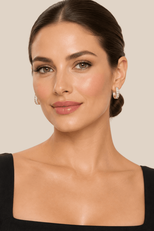 Woman wearing Peyton CZ Huggie Earrings