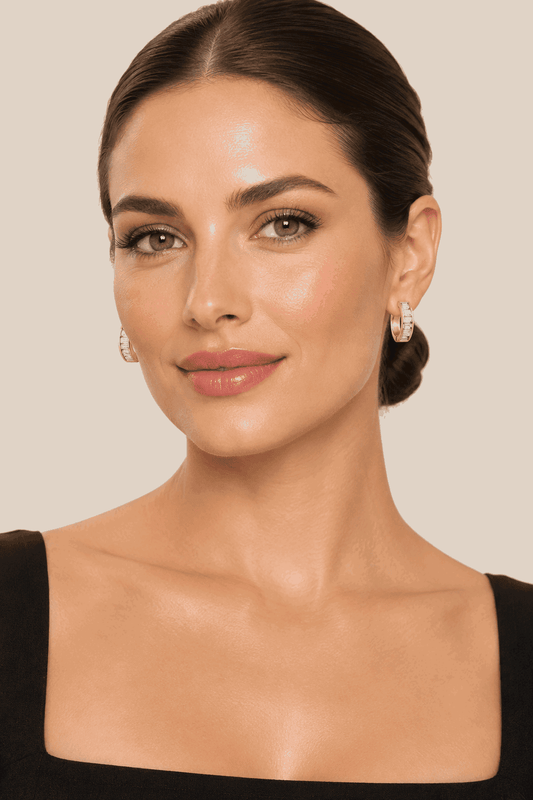Woman wearing Peyton CZ Huggie Earrings