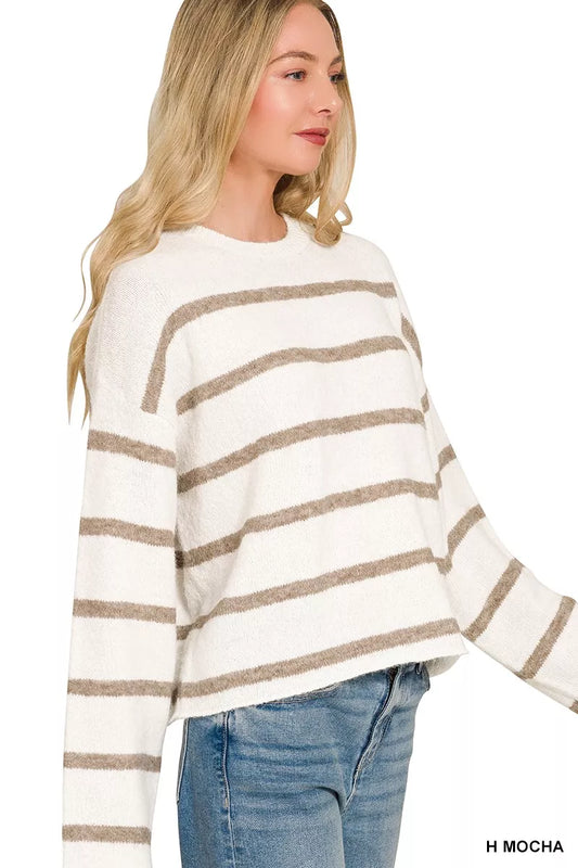 side view of woman wearing a stripe sweater