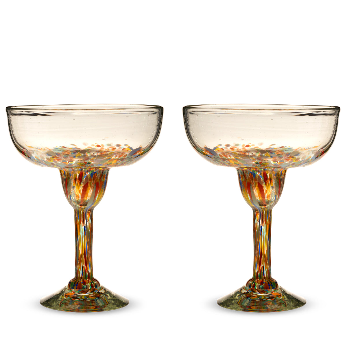 Two empty Segunda Vida Artistico margarita glasses with multicolored speckles in the bowls, stems, and bases.